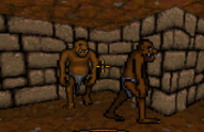 Ultima Underworld (DOS) screenshot: a light brown troll (left) and dark brown great troll (right)